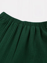 tenue Ă©lĂ©gante femme en vert forĂȘt