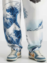 Détail du bas du pantalon harem japonais Koiwave avec motif vague, coupe ample streetwear japonais