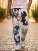 Pantalon harem japonais Koiwave porté par un homme en marche, motif vague et carpe, style streetwear japonais urbain
