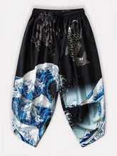 Vue avant du pantalon harem japonais noir Koiwave avec motif vague, carpe et dragon, style streetwear japonais