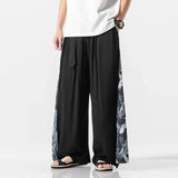 Pantalon Homme Japonais Haru noir, coupe ample style kimono avec motifs japonais sur les côtés et tissu fluide
