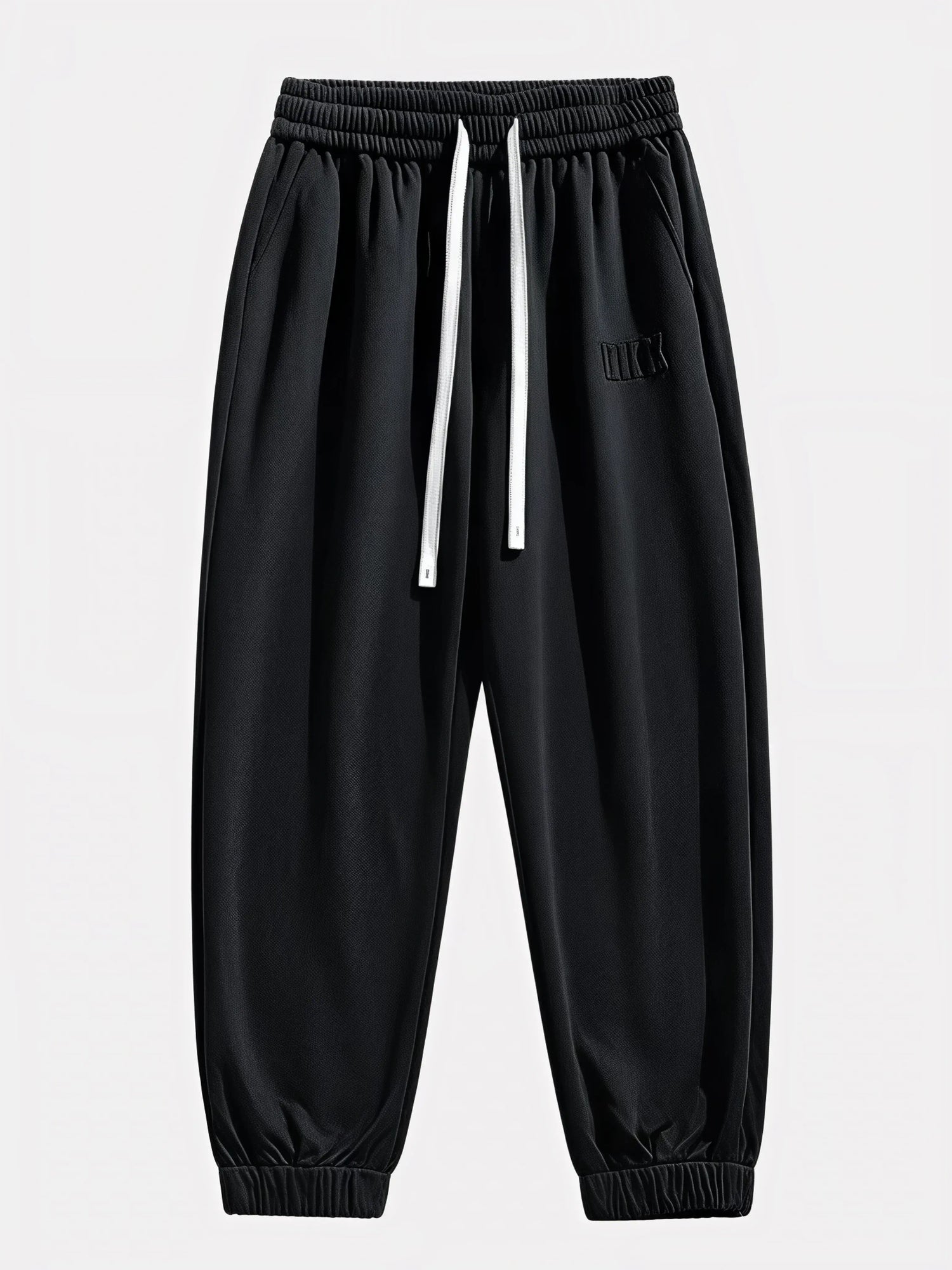 Pantalon Japonais Homme Akira noir vu de face, taille élastique et cordons blancs