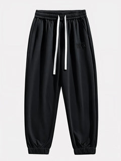 Pantalon Japonais Homme Akira noir vu de face, taille élastique et cordons blancs