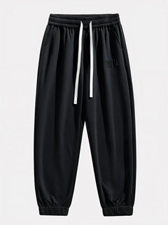 Pantalon Japonais Homme Akira noir vu de face, taille élastique et cordons blancs