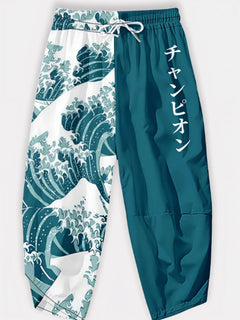 Pantalon japonais Élite Vagues en packshot, motif vague Hokusai et coupe ample bicolore.