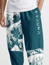 Gros plan sur le pantalon japonais Élite Vagues, motif vague Hokusai et inscription japonaise.