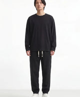 Pantalon japonais Kaito noir porte par un homme, fond blanc, jogger en coton style japonais